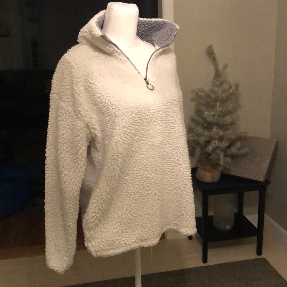 White 1/4 zip Sherpa pullover jacket.